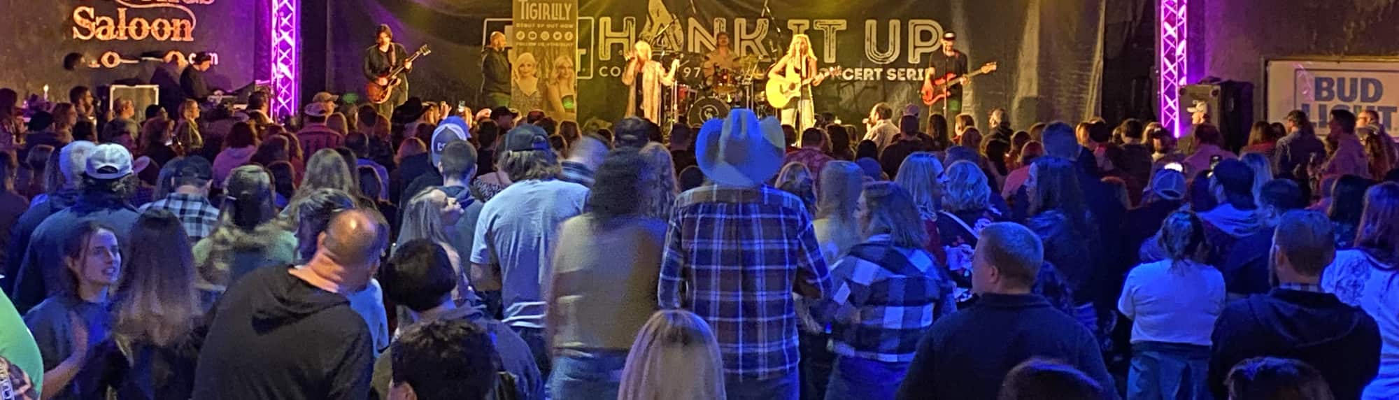 country concert with fans wearing cowboy hats Biloxi